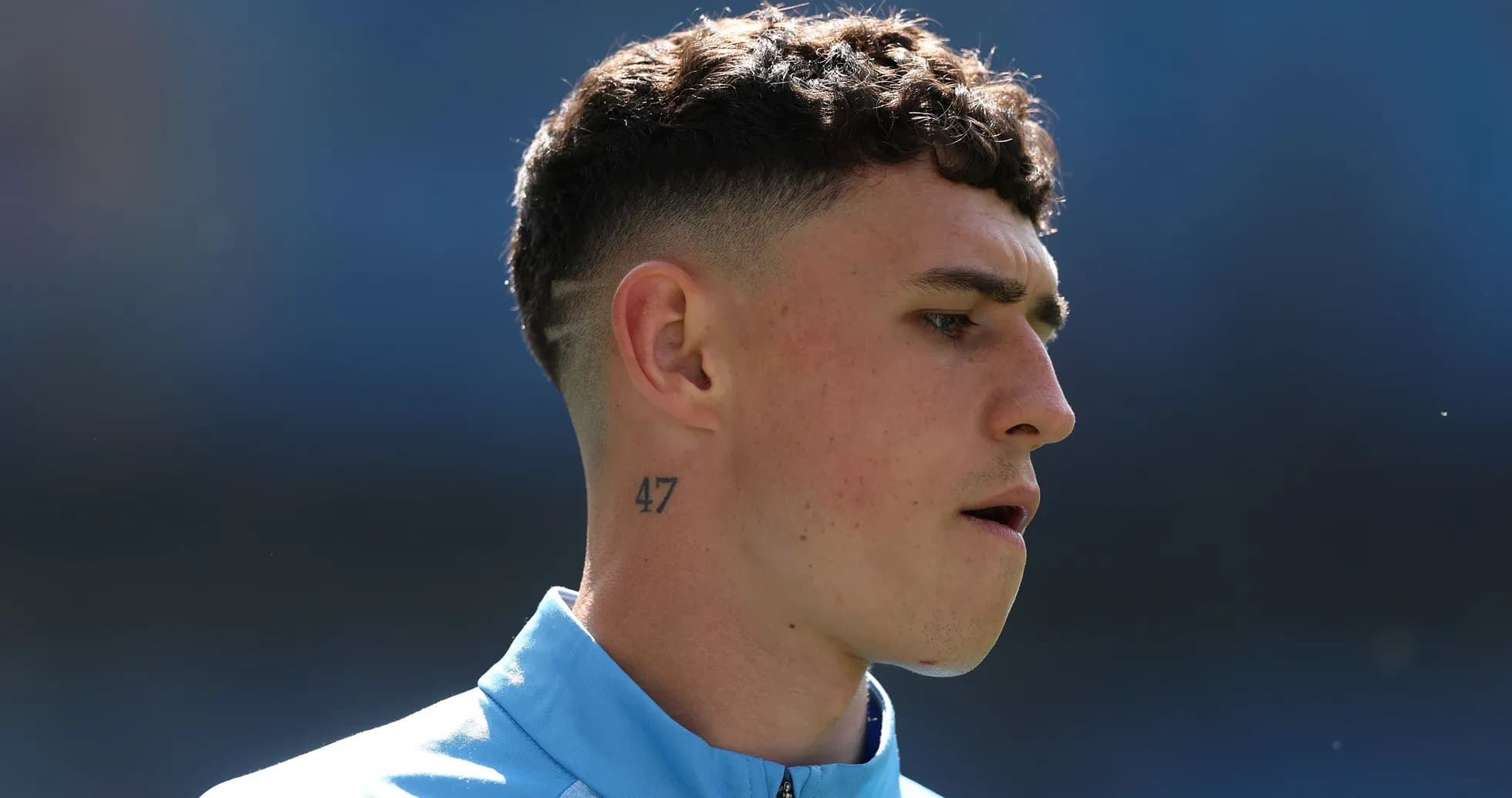 Player with short hair and tattoo on neck Player with short hair and tattoo on neck