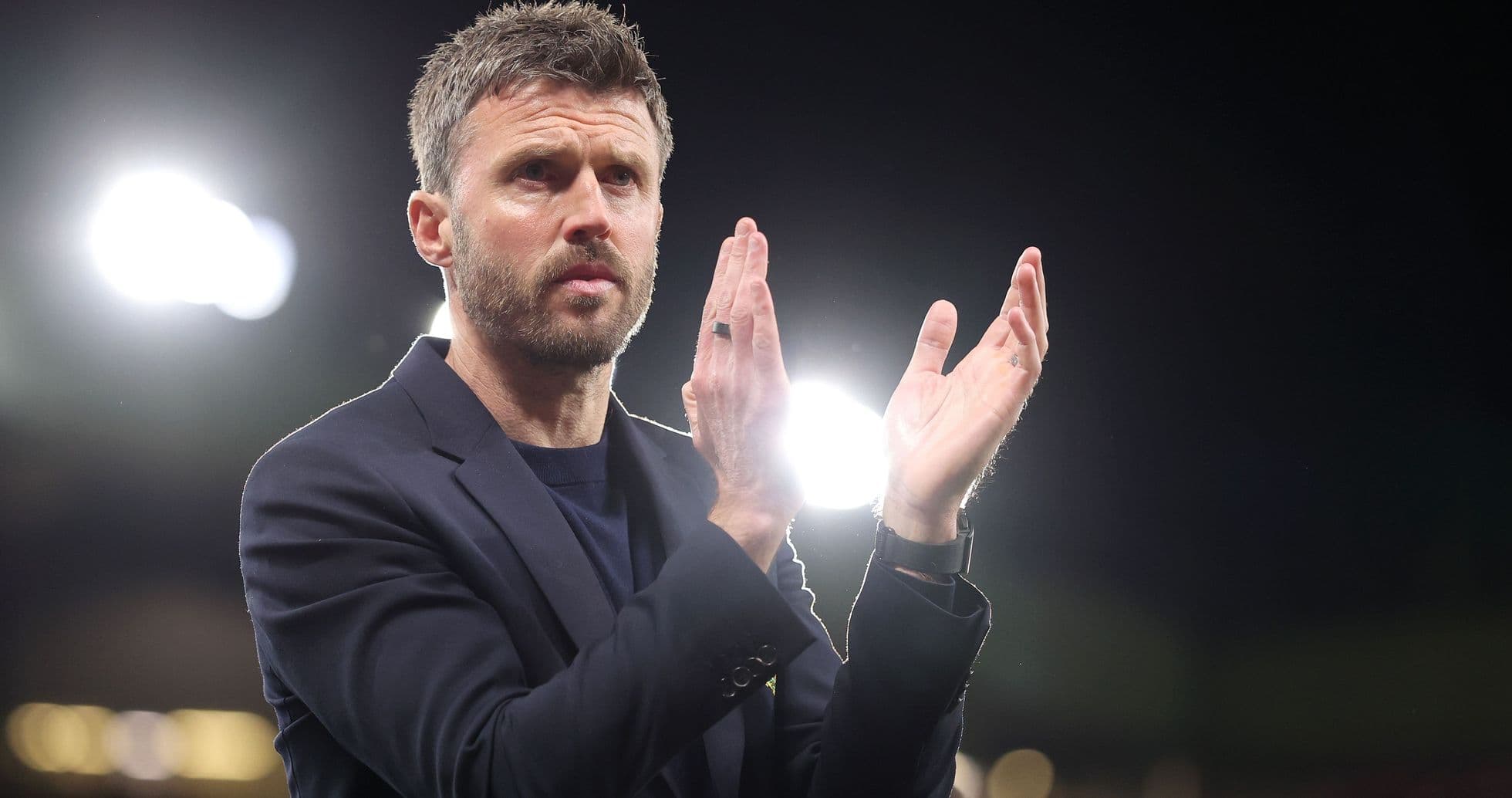 Manager applauding during a match at stadium Manager applauding during a match at stadium