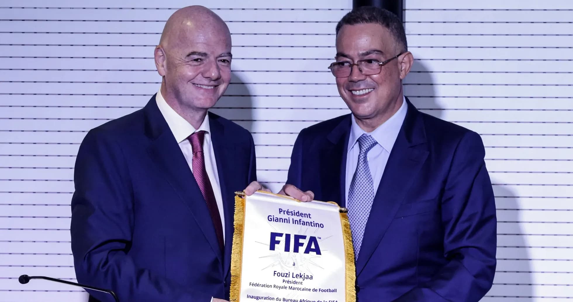 Gianni Infantino presenting FIFA banner to Fouzi Lekjaa Gianni Infantino presenting FIFA banner to Fouzi Lekjaa
