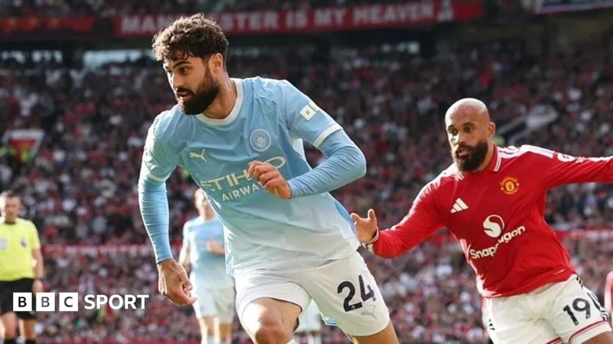 Player in blue jersey evading opponent in red jersey Player in blue jersey evading opponent in red jersey