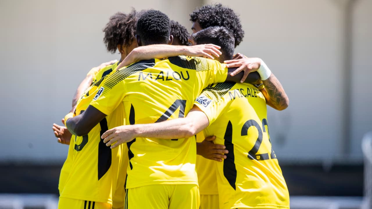 Columbus Crew II players celebrating together Columbus Crew II players celebrating together