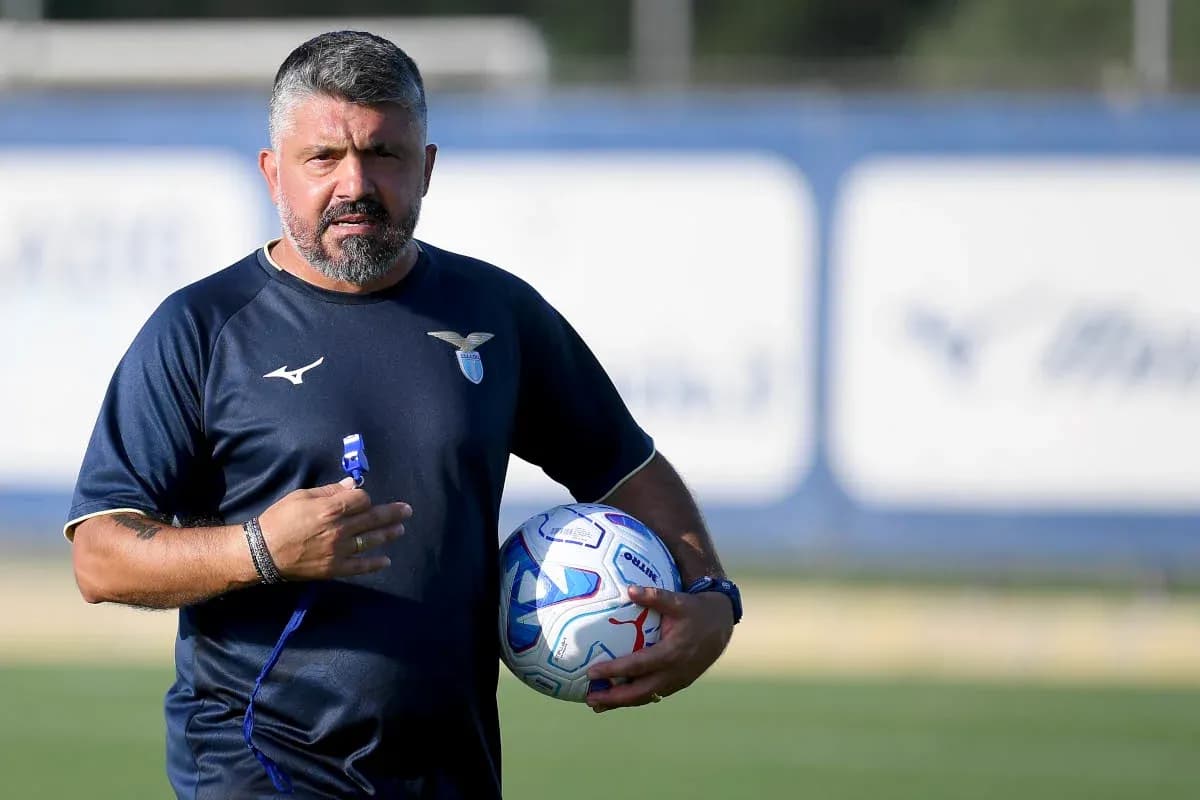 Coach holding a football during training session Coach holding a football during training session
