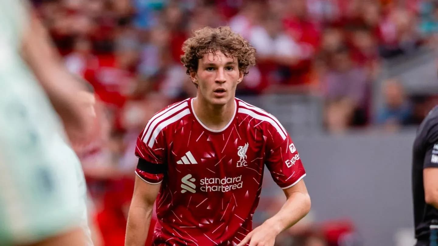 Liverpool player in red kit during match action Liverpool player in red kit during match action
