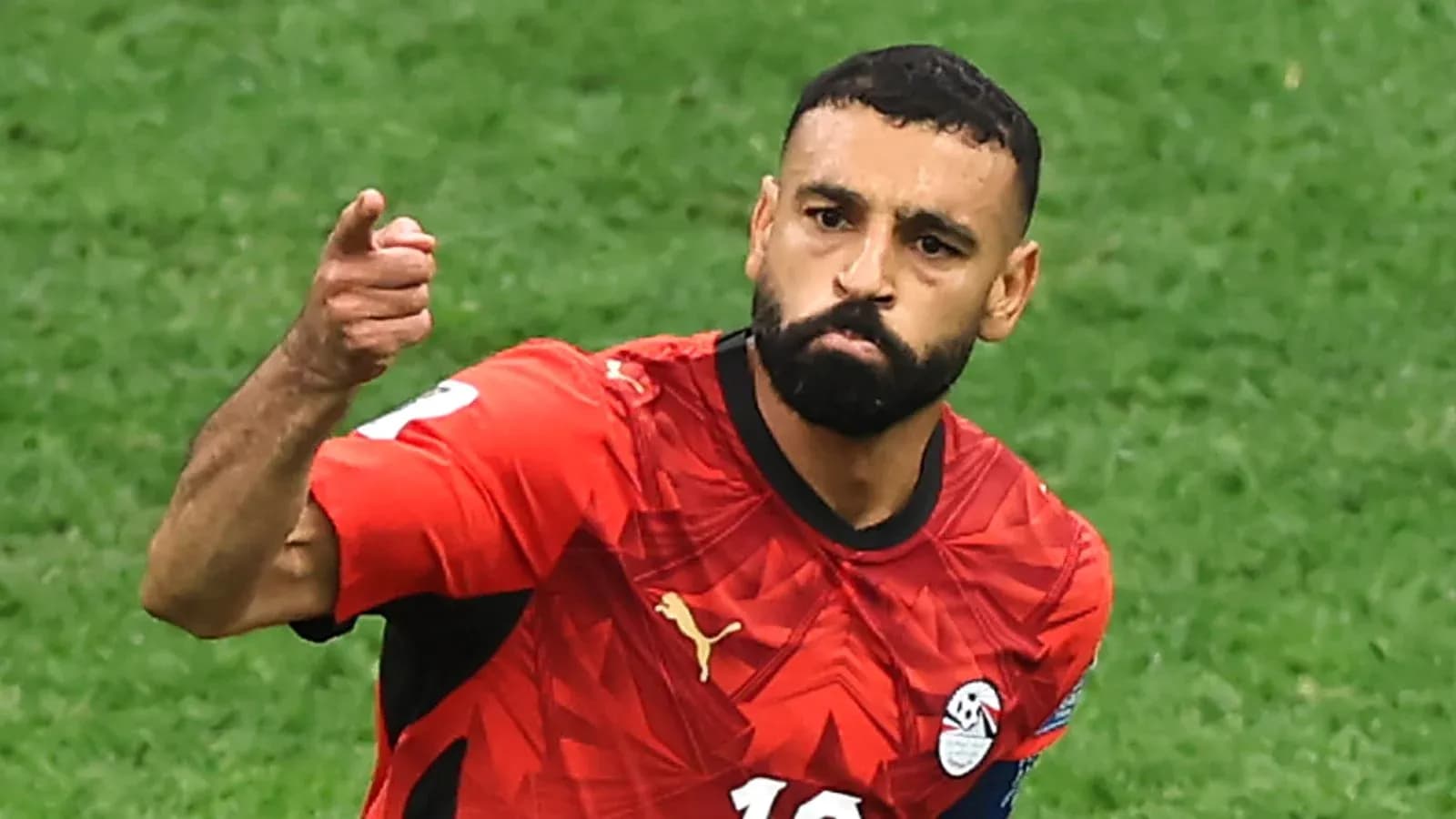 Player celebrating after scoring a goal for Egypt Player celebrating after scoring a goal for Egypt