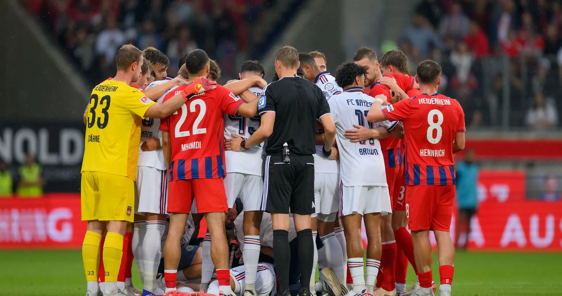 Players from both teams huddled during a match Players from both teams huddled during a match