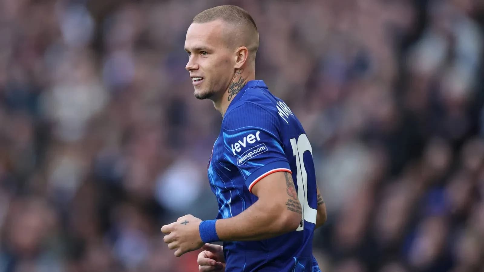 Player wearing blue jersey with number 10 Player wearing blue jersey with number 10