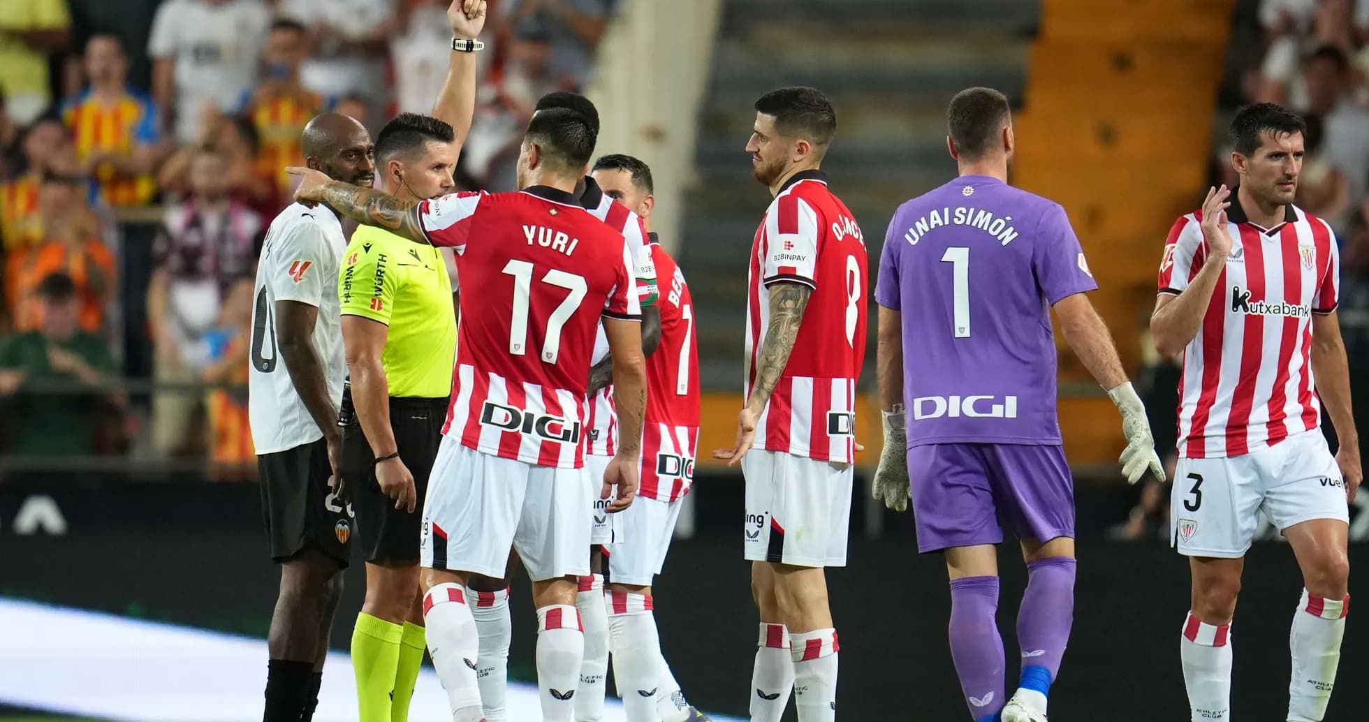 Players reacting to a red card during match Players reacting to a red card during match