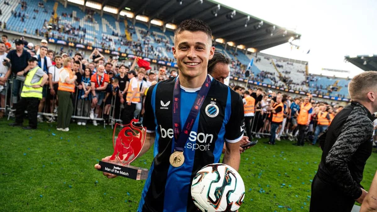 Player holding Man of the Match trophy on field Player holding Man of the Match trophy on field