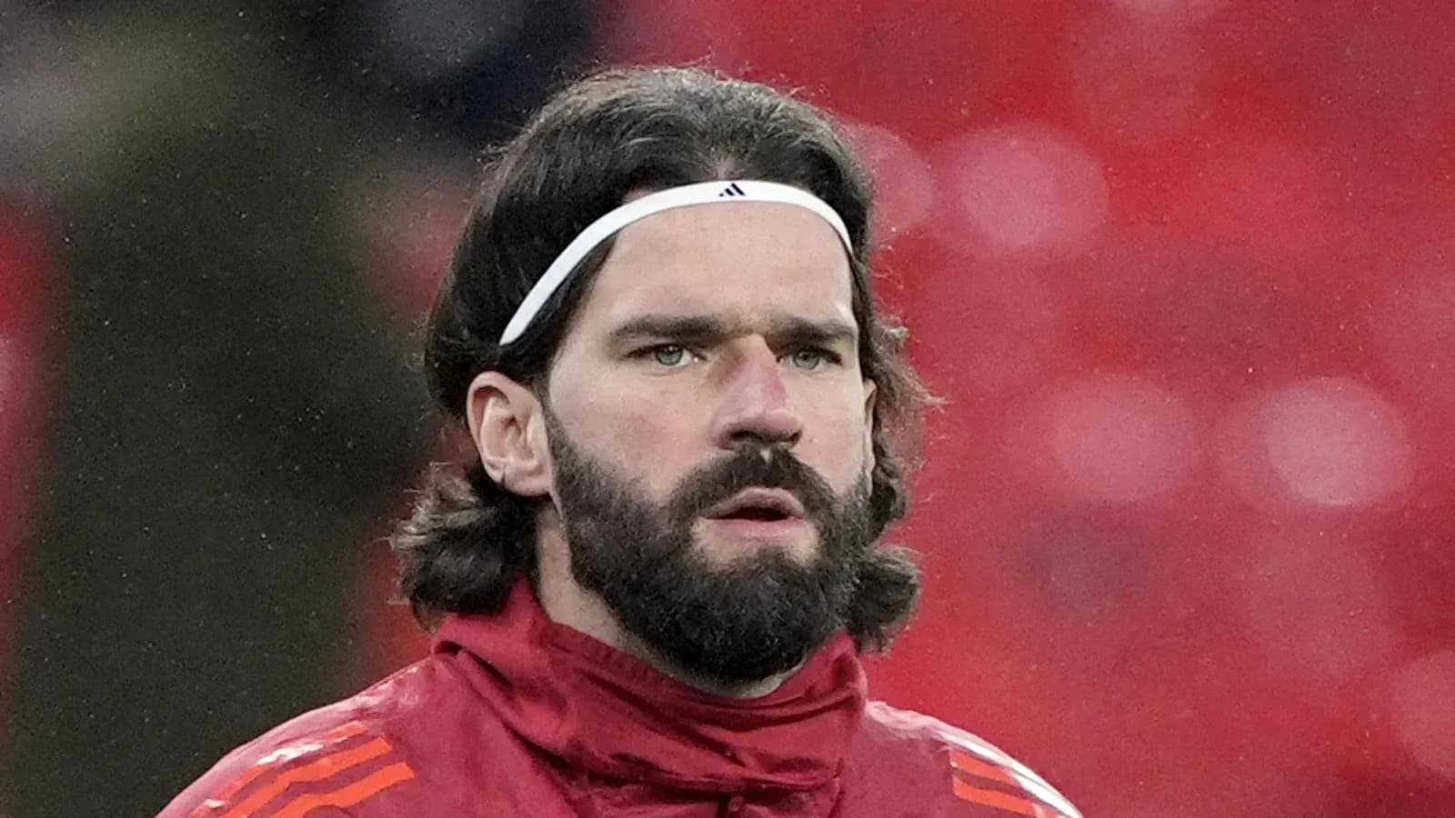 Player with long hair and beard in training gear Player with long hair and beard in training gear