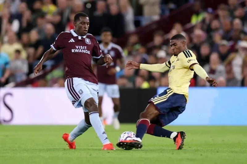 Two players contesting the ball during a match Two players contesting the ball during a match