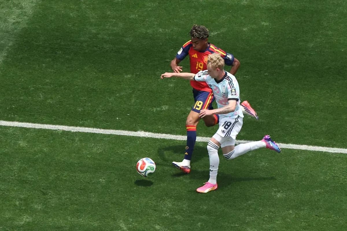 Players contesting for the ball during a match Players contesting for the ball during a match