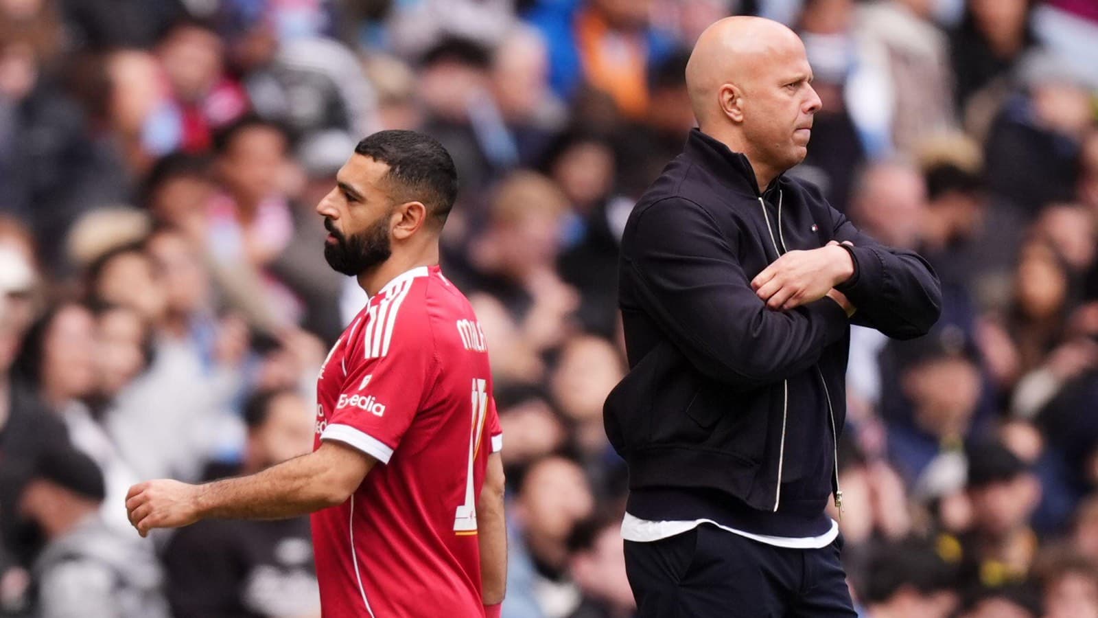 Player walking past coach during match Player walking past coach during match