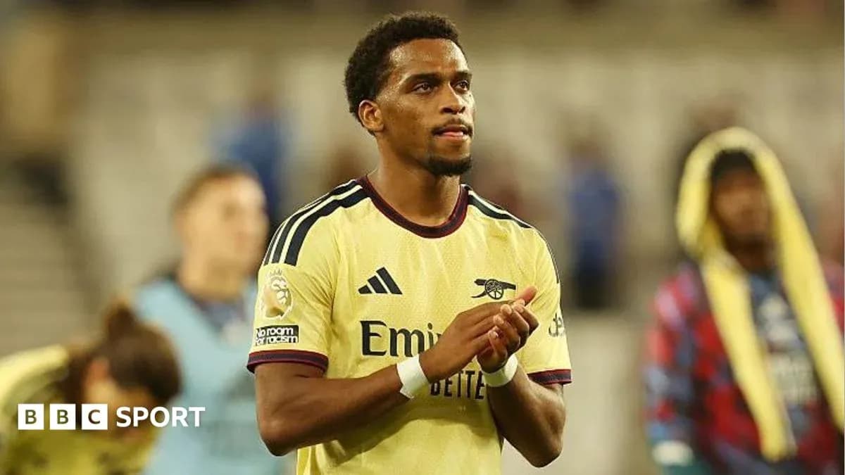 Player applauding fans after match in Arsenal kit Player applauding fans after match in Arsenal kit