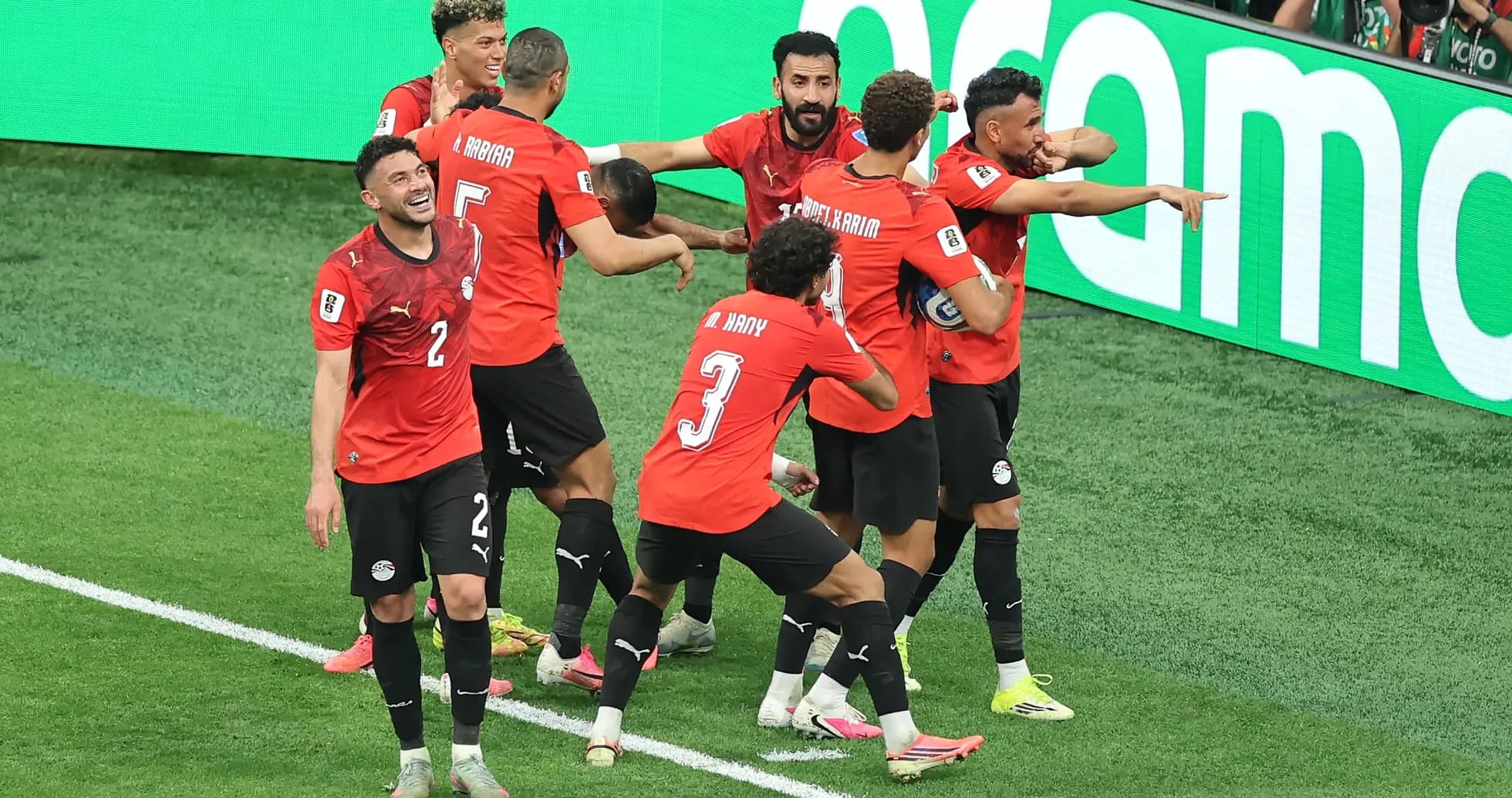 Egyptian players celebrating a goal on the field Egyptian players celebrating a goal on the field