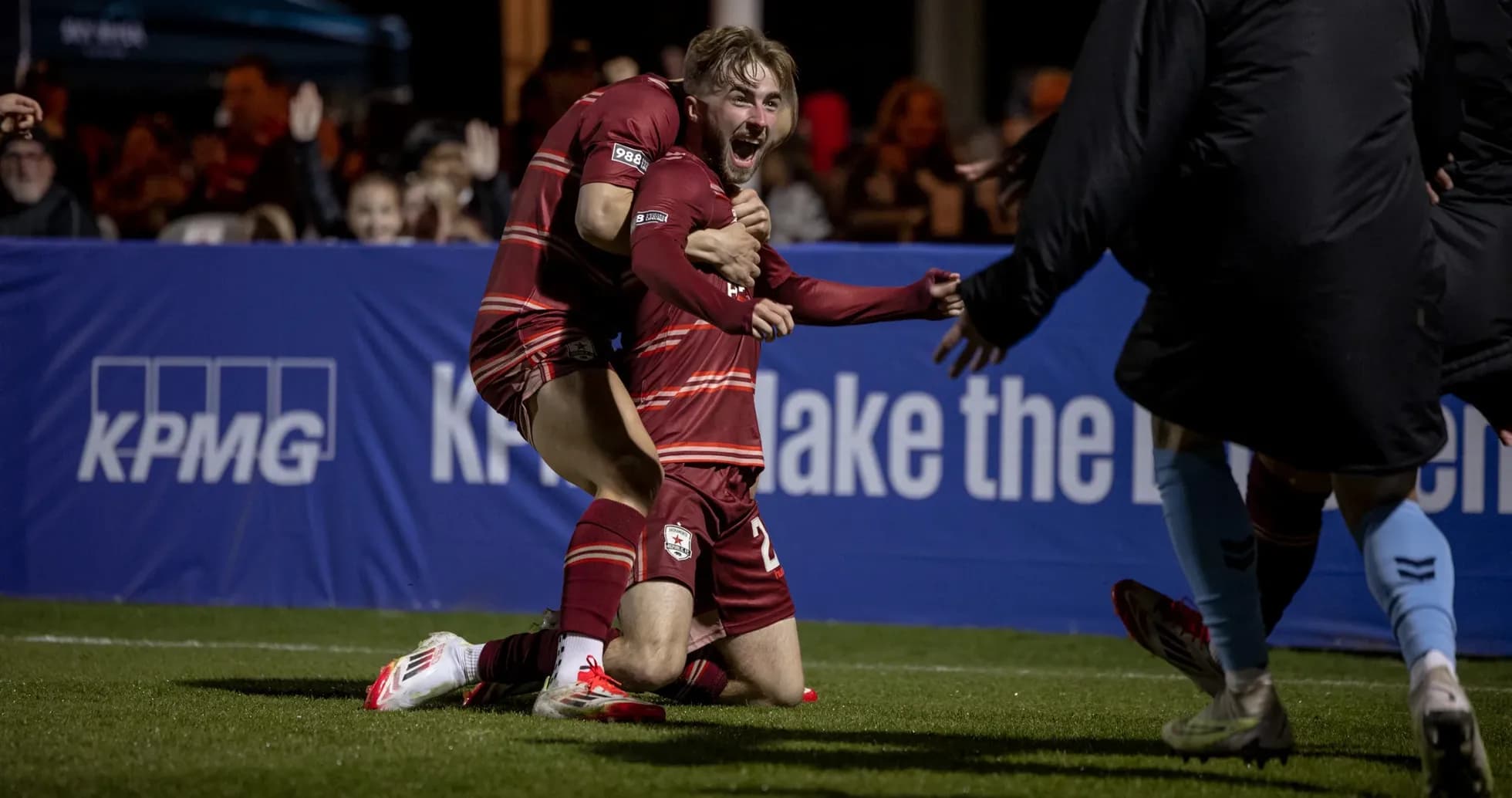 Players celebrating a goal during match Players celebrating a goal during match