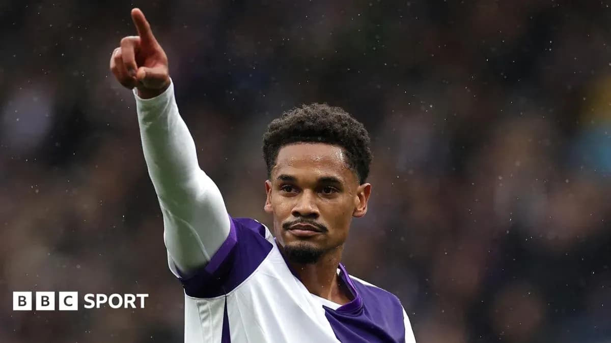 Player celebrating and pointing during match action Player celebrating and pointing during match action