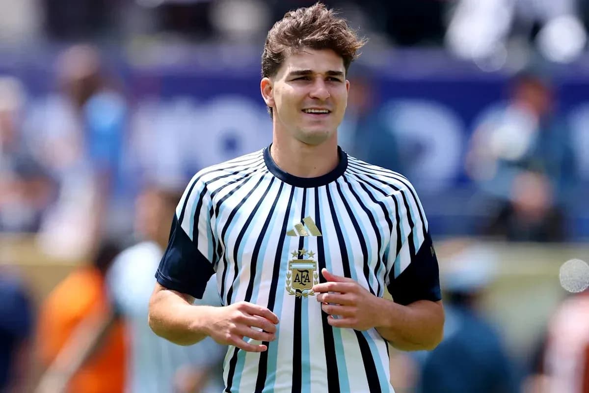 Player wearing striped Argentina jersey on field Player wearing striped Argentina jersey on field
