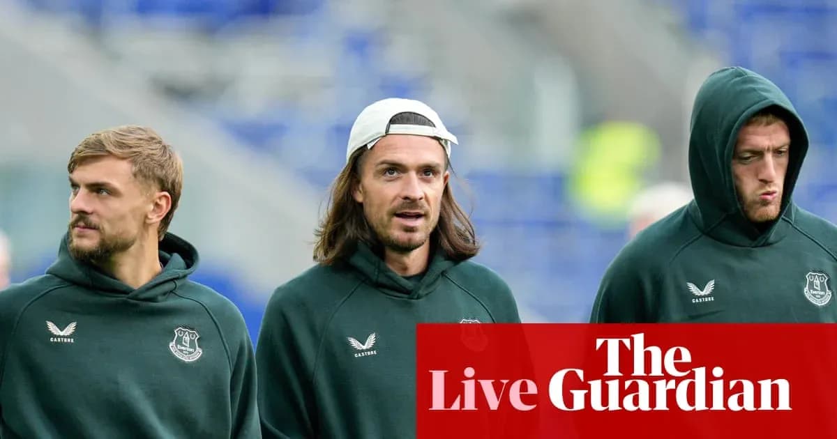 Three football players in Everton hoodies walking Three football players in Everton hoodies walking