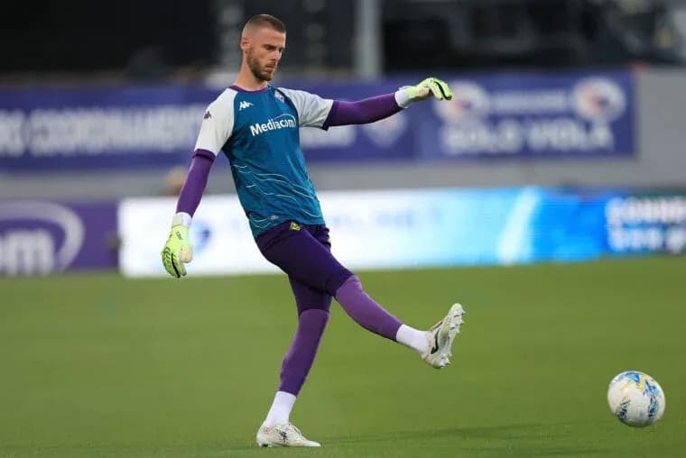 Goalkeeper practicing a kick during training session Goalkeeper practicing a kick during training session