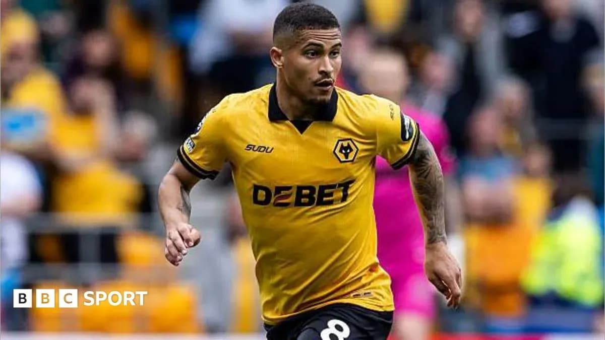 Player running in yellow Wolves jersey during match Player running in yellow Wolves jersey during match