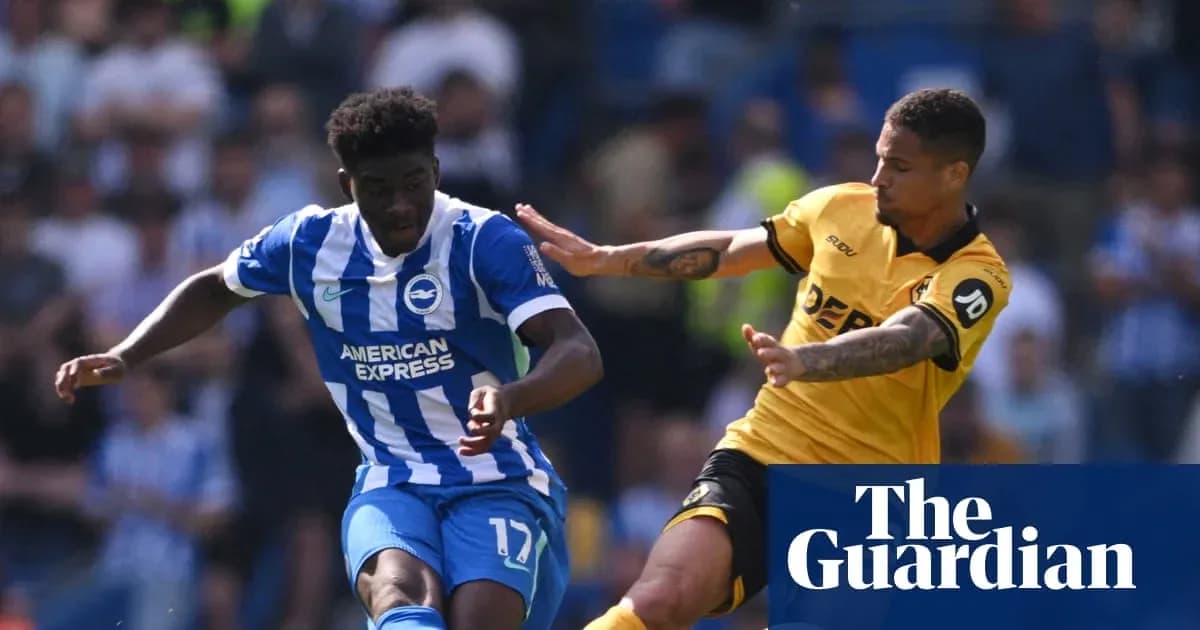 Player from Brighton dribbling past opponent during match Player from Brighton dribbling past opponent during match