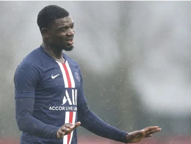 Player gesturing during training session in rain Player gesturing during training session in rain