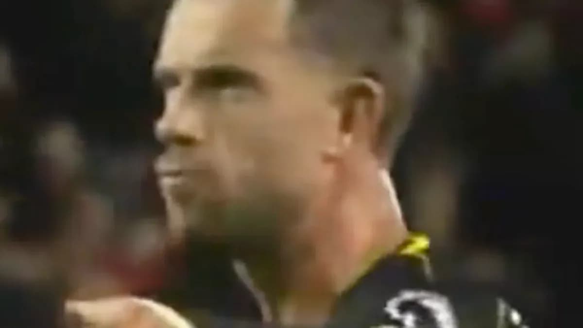 Player reacting during a match in dark uniform Player reacting during a match in dark uniform