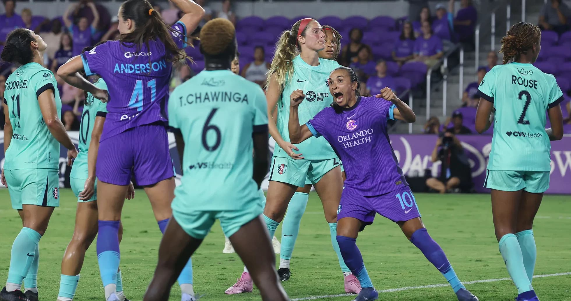 Orlando Pride players celebrating a goal Orlando Pride players celebrating a goal
