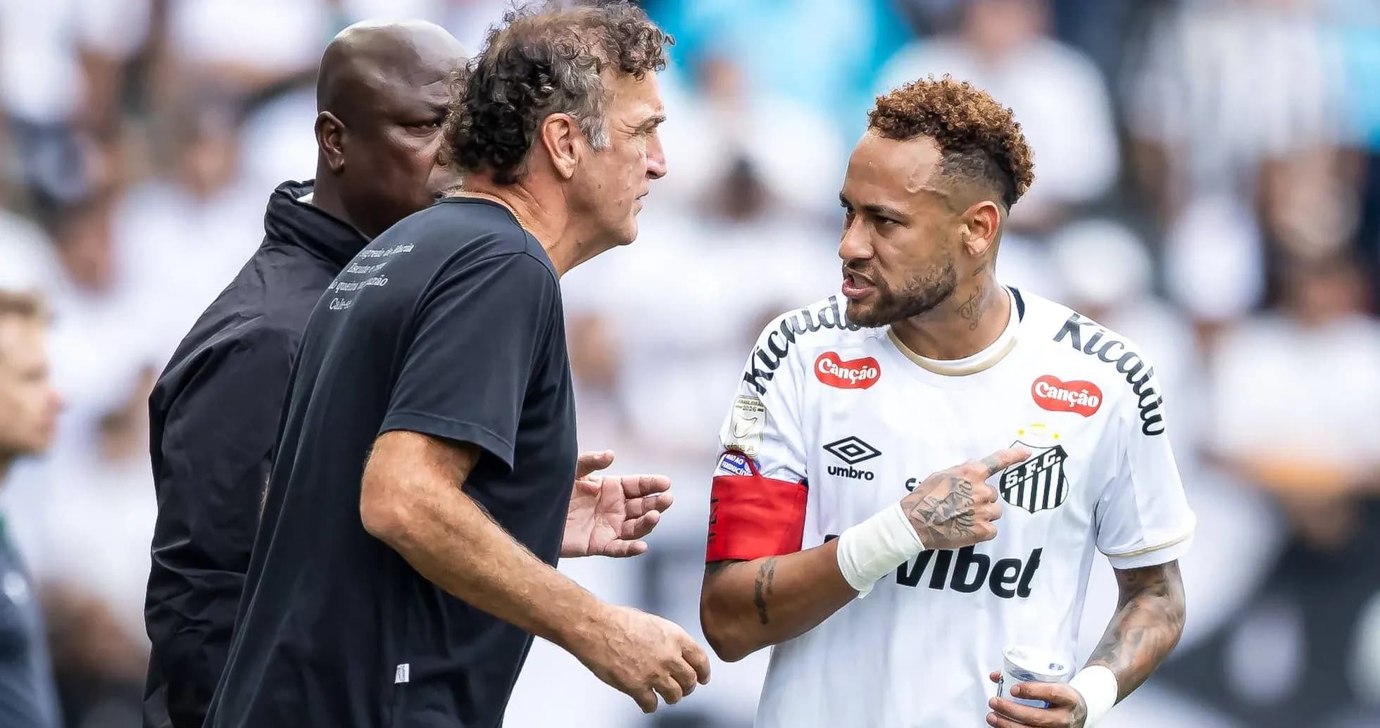 Neymar discussing strategy with coach during match Neymar discussing strategy with coach during match