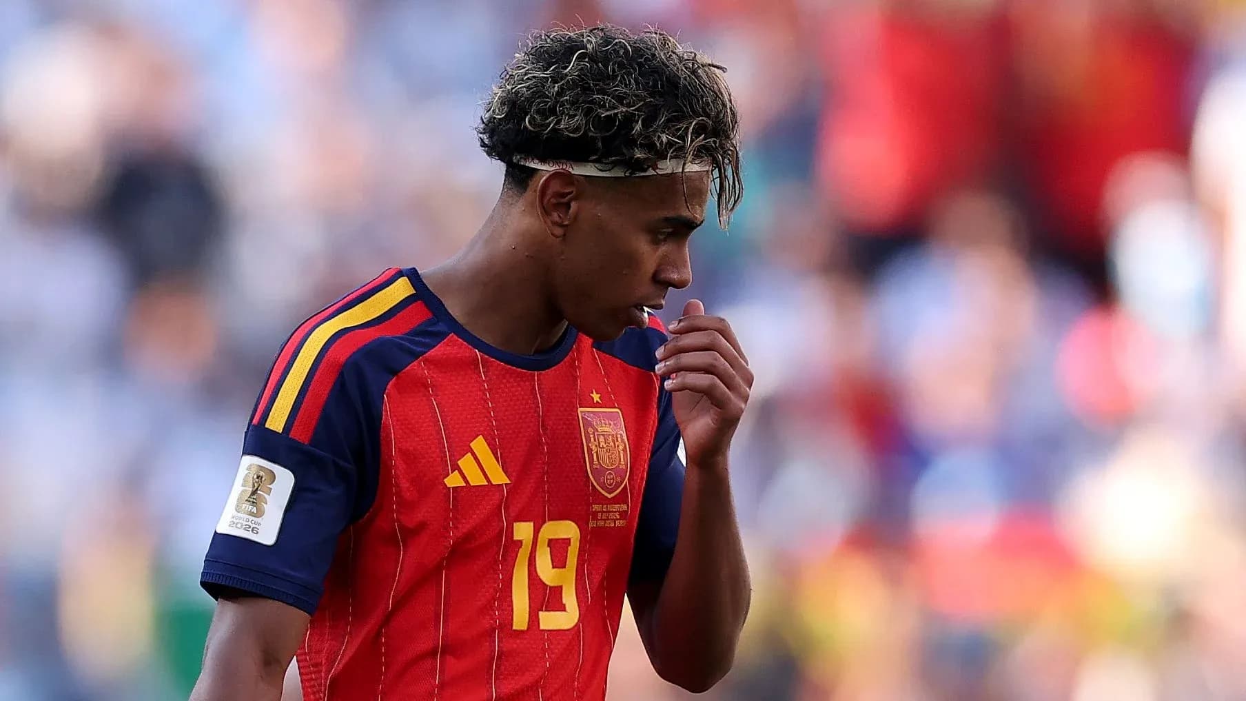 Player in Spain jersey walking off the field Player in Spain jersey walking off the field