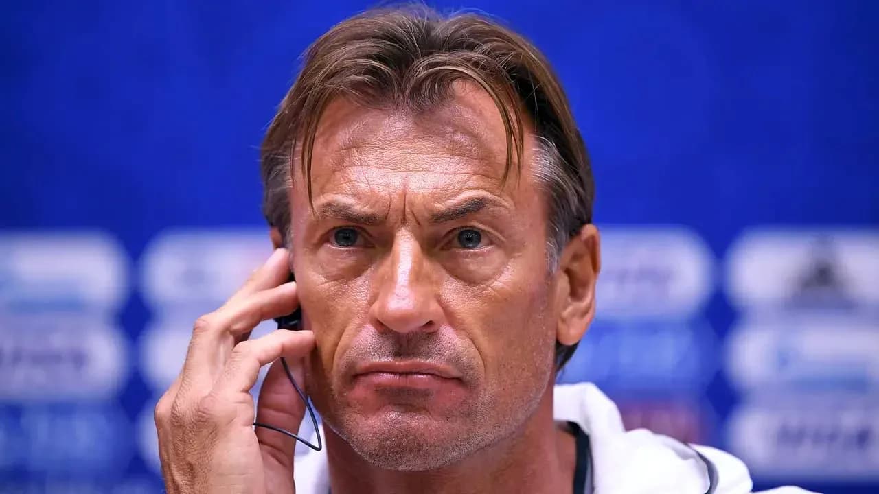 Coach speaking into a headset at press conference Coach speaking into a headset at press conference