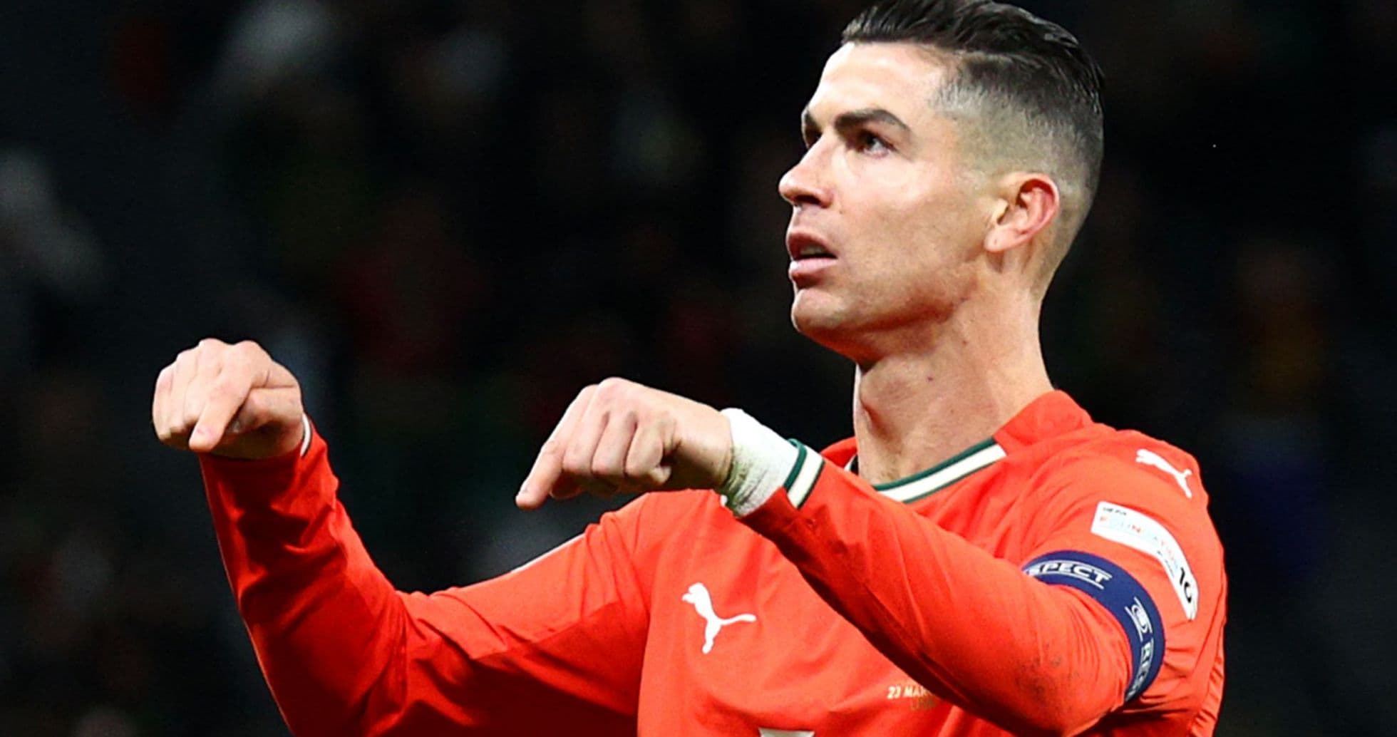 Player celebrating in orange jersey during match Player celebrating in orange jersey during match