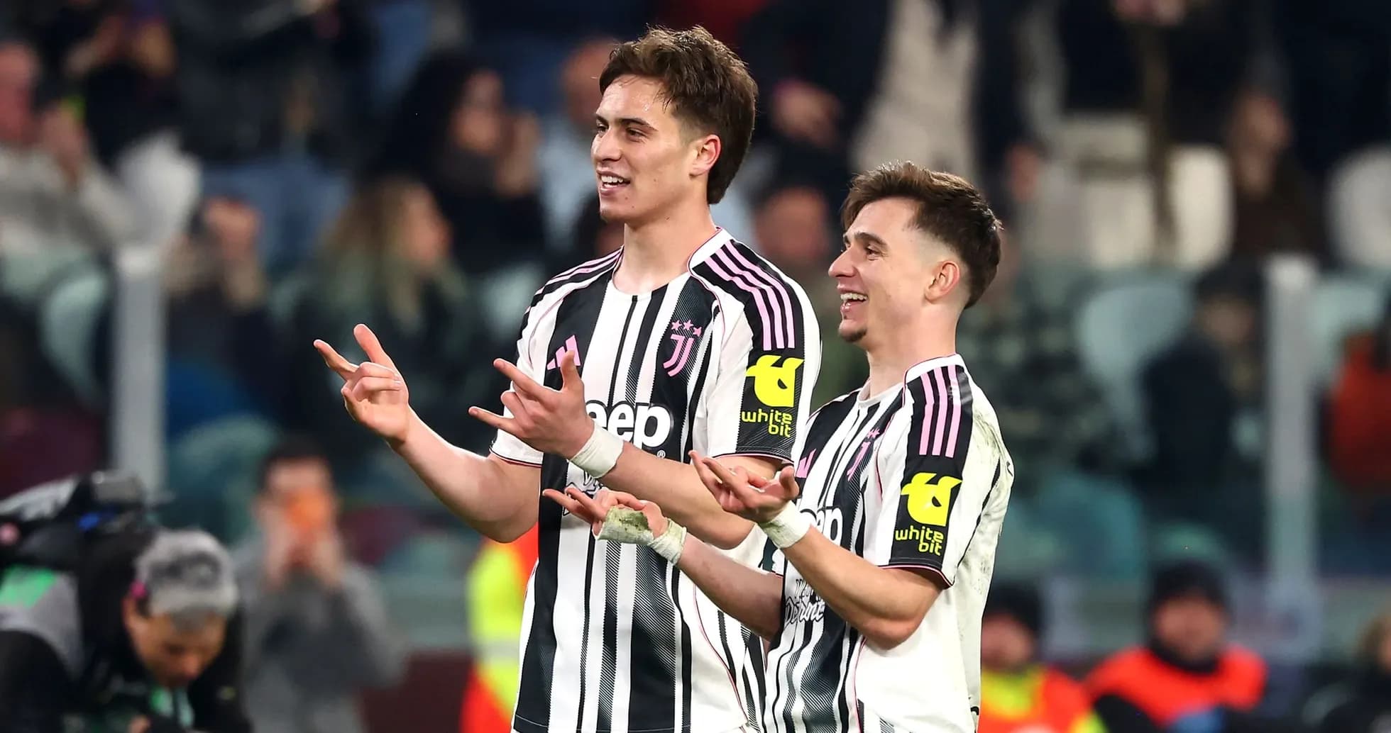 Two Juventus players celebrating on the field Two Juventus players celebrating on the field