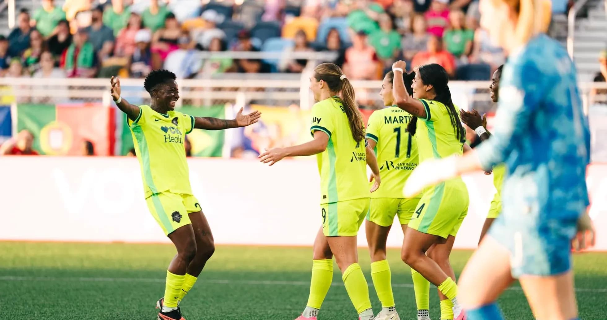 Players celebrating during NWSL match Players celebrating during NWSL match