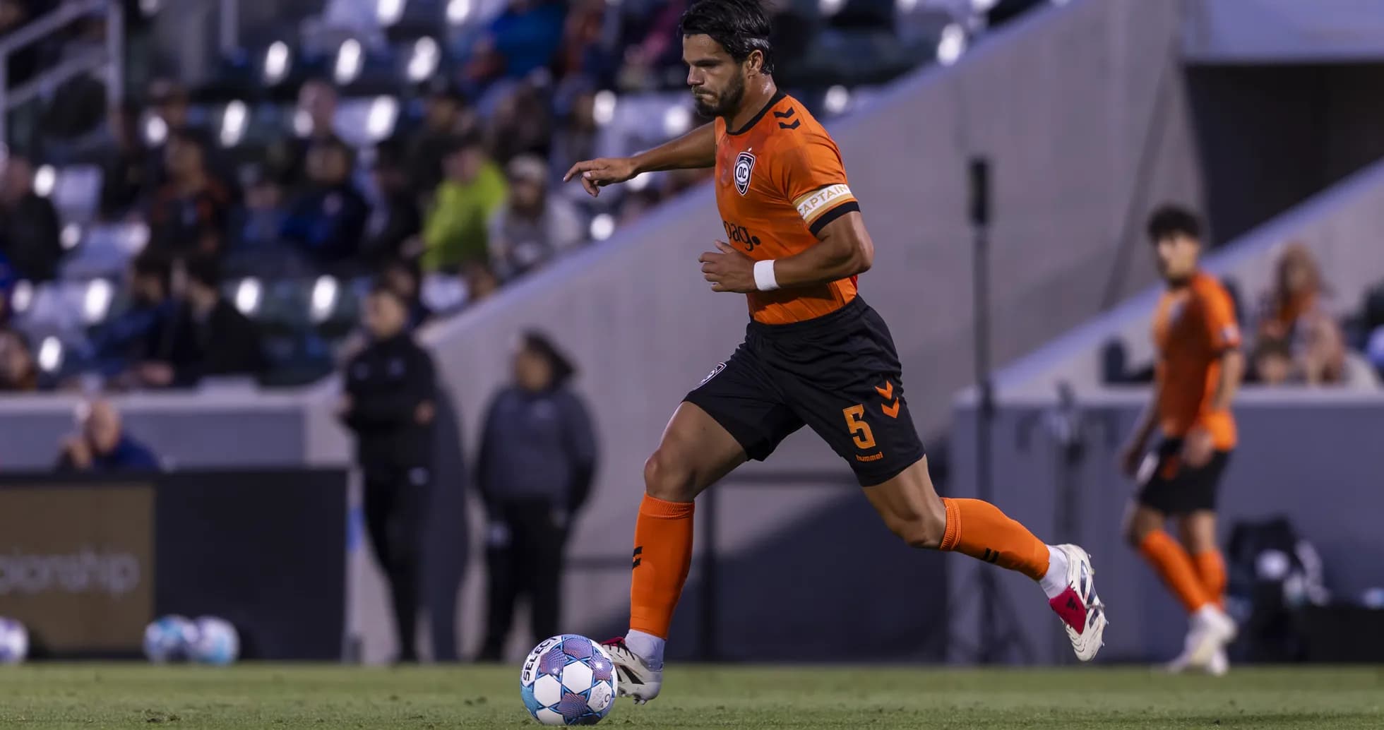 Player running with ball during New Mexico United match Player running with ball during New Mexico United match