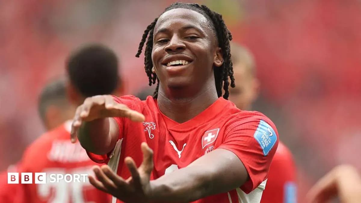Player celebrating during a match in red uniform Player celebrating during a match in red uniform