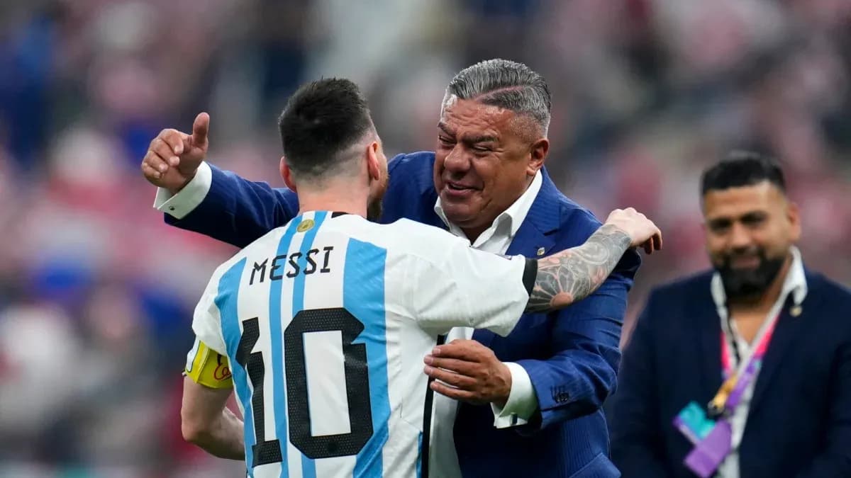 Lionel Messi embracing a coach after a match Lionel Messi embracing a coach after a match