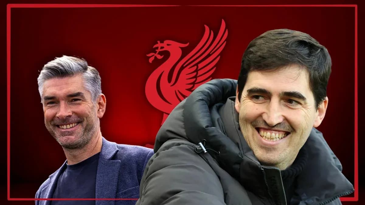 Two coaches smiling with Liverpool logo background Two coaches smiling with Liverpool logo background
