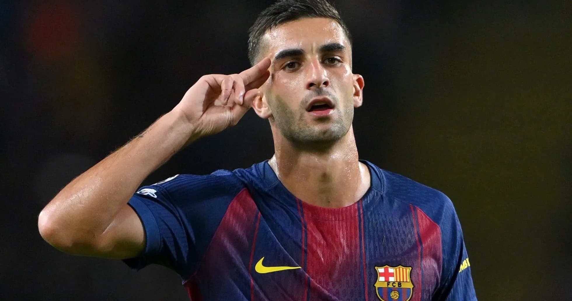 Player celebrating a goal with a salute gesture Player celebrating a goal with a salute gesture