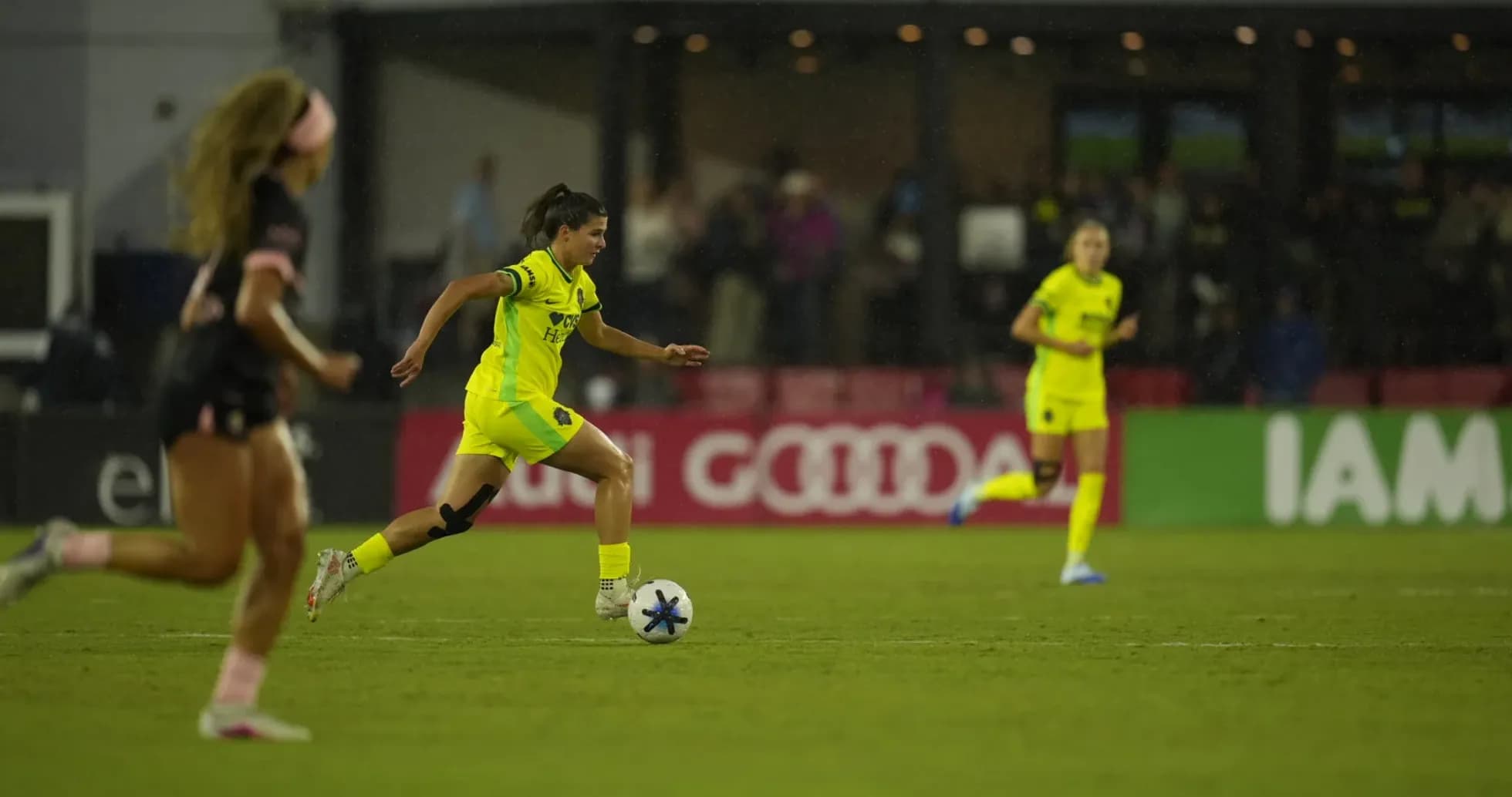 Player dribbling ball during NWSL match Player dribbling ball during NWSL match