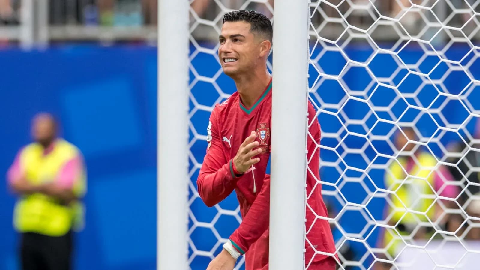 Cristiano Ronaldo gesturing near goalpost during match Cristiano Ronaldo gesturing near goalpost during match