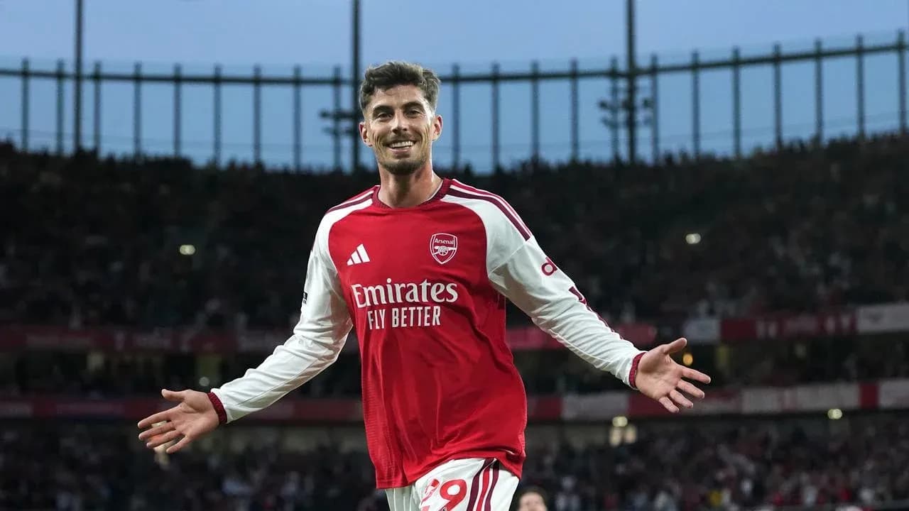 Arsenal player celebrating a goal at the stadium Arsenal player celebrating a goal at the stadium