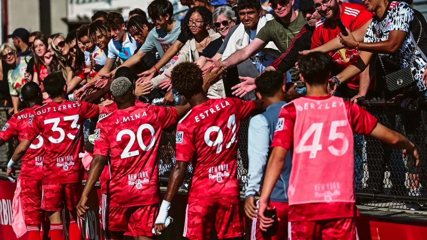 Players celebrating with fans after match Players celebrating with fans after match