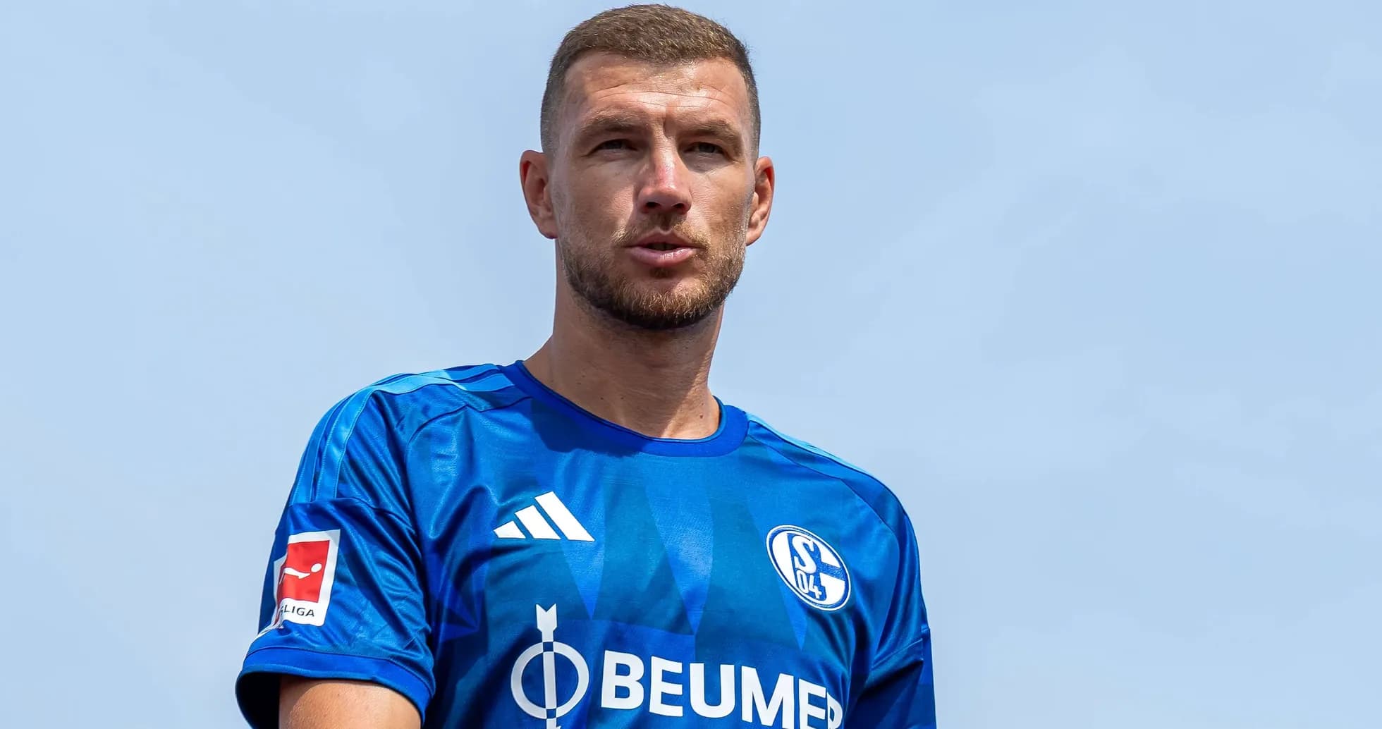 Player in blue Schalke 04 jersey outdoors Player in blue Schalke 04 jersey outdoors
