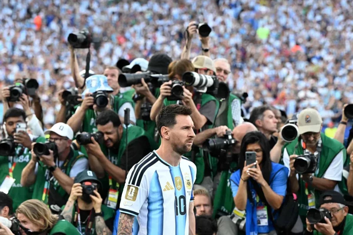 Lionel Messi surrounded by photographers on the field Lionel Messi surrounded by photographers on the field