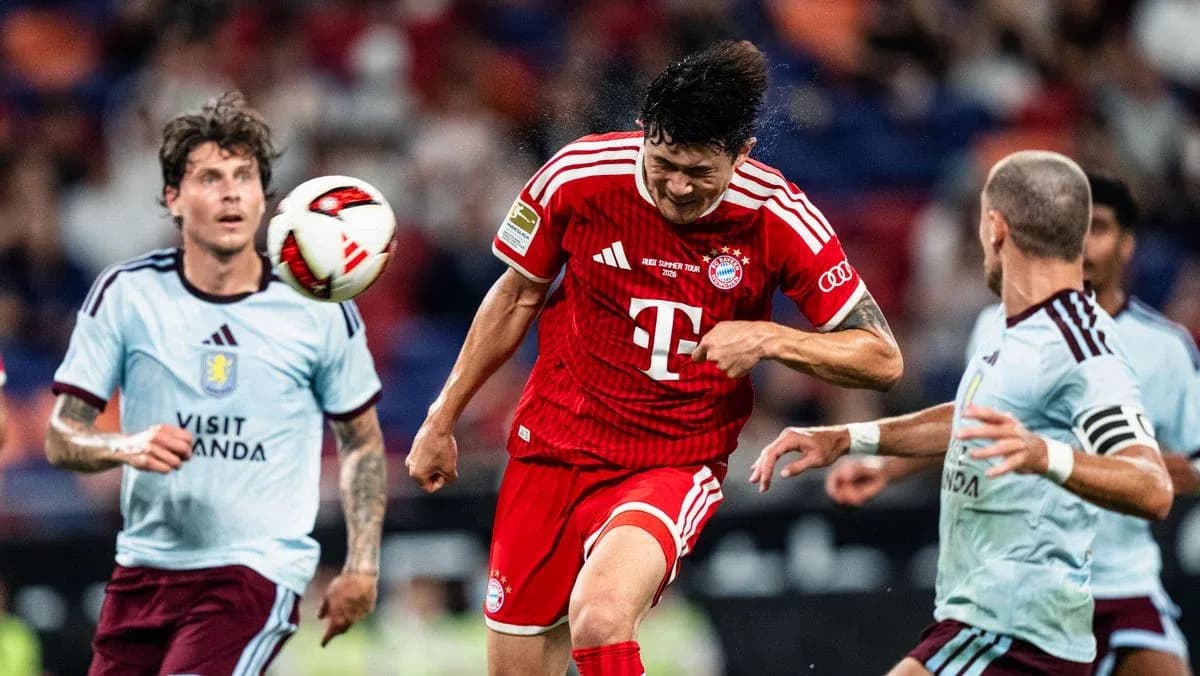 Player heading the ball during match action Player heading the ball during match action
