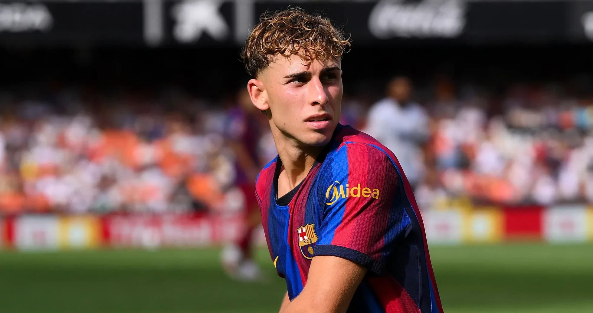 Barcelona player looking focused on the pitch Barcelona player looking focused on the pitch