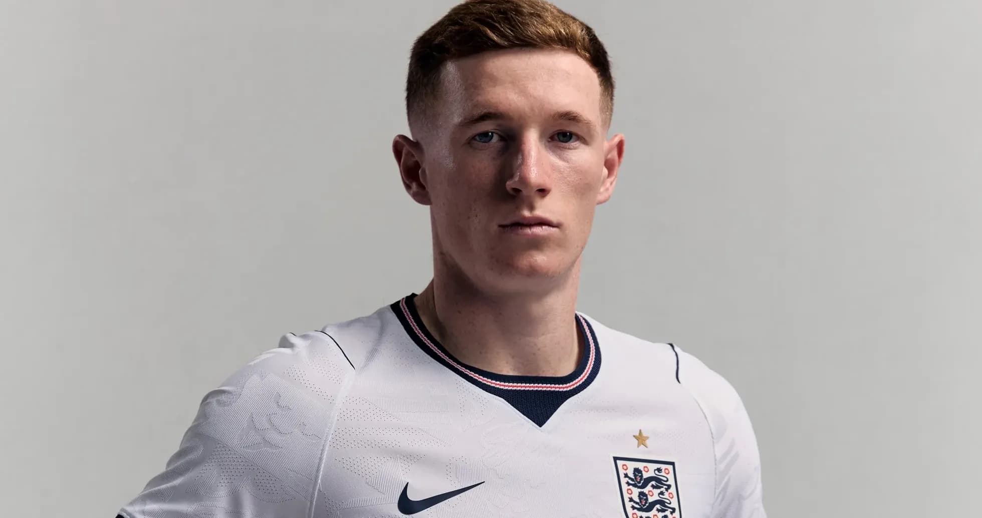 Player in England national team jersey posing confidently Player in England national team jersey posing confidently