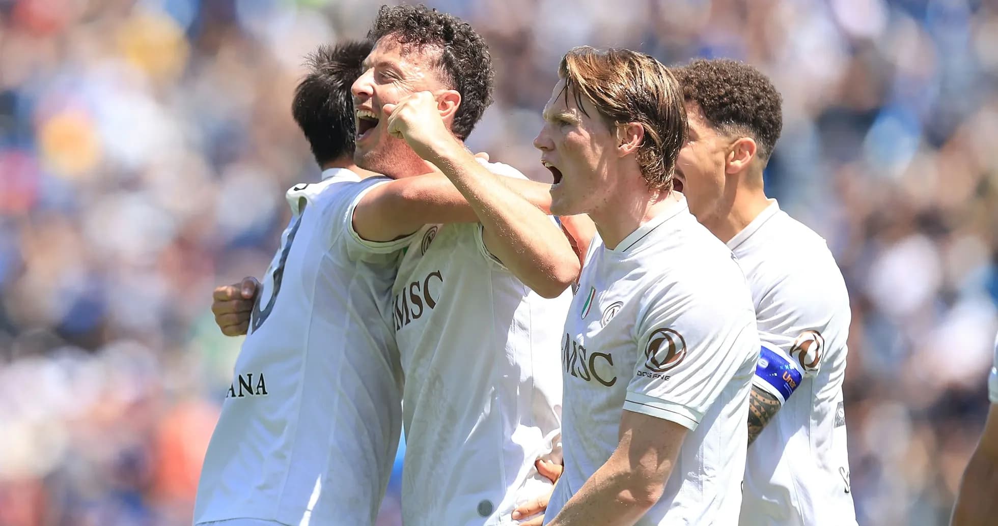 Players celebrating a goal during a match Players celebrating a goal during a match