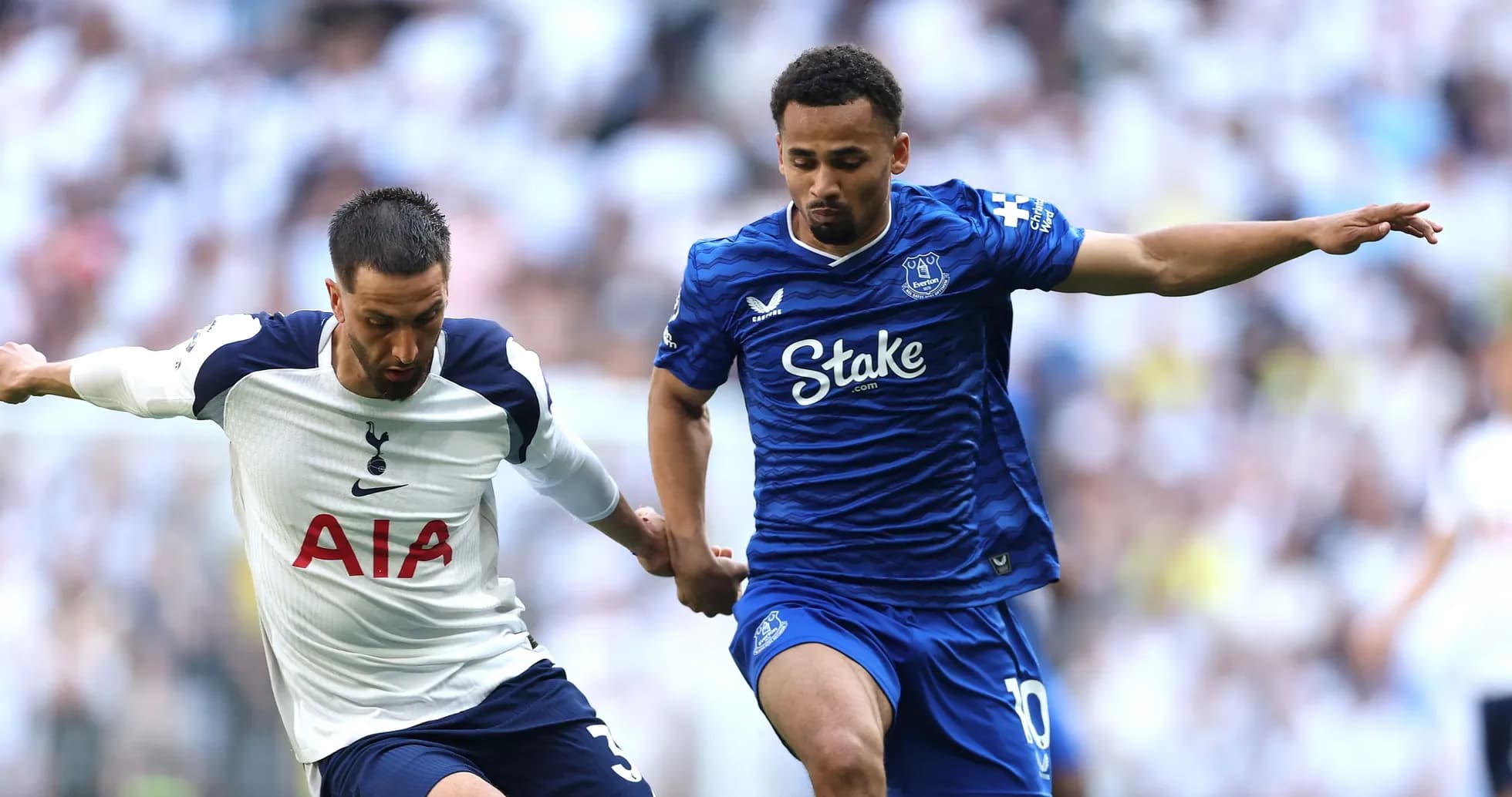 Tottenham and Everton players battling for possession Tottenham and Everton players battling for possession